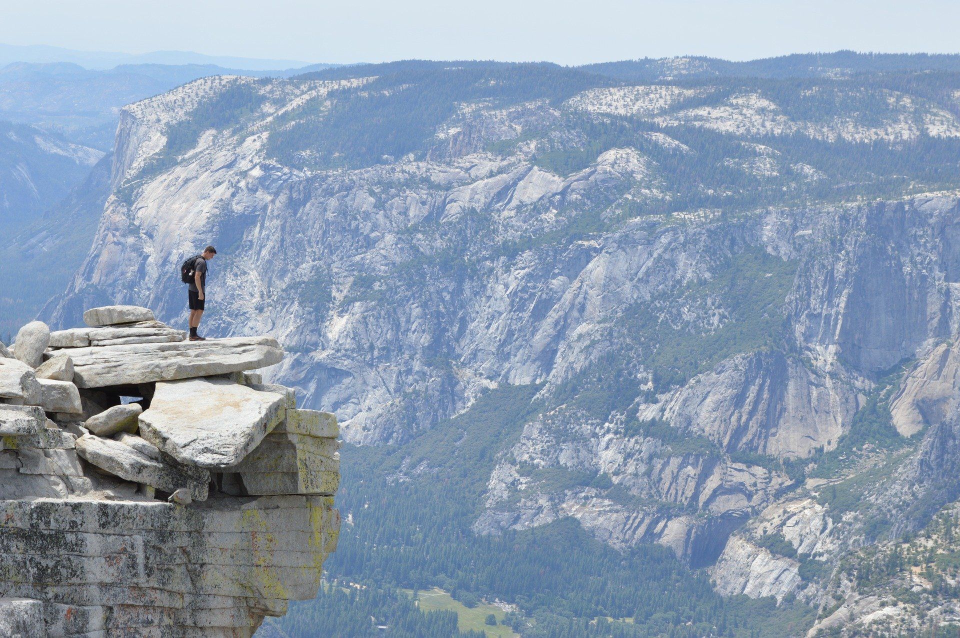 Man standing on the edge of a cliff