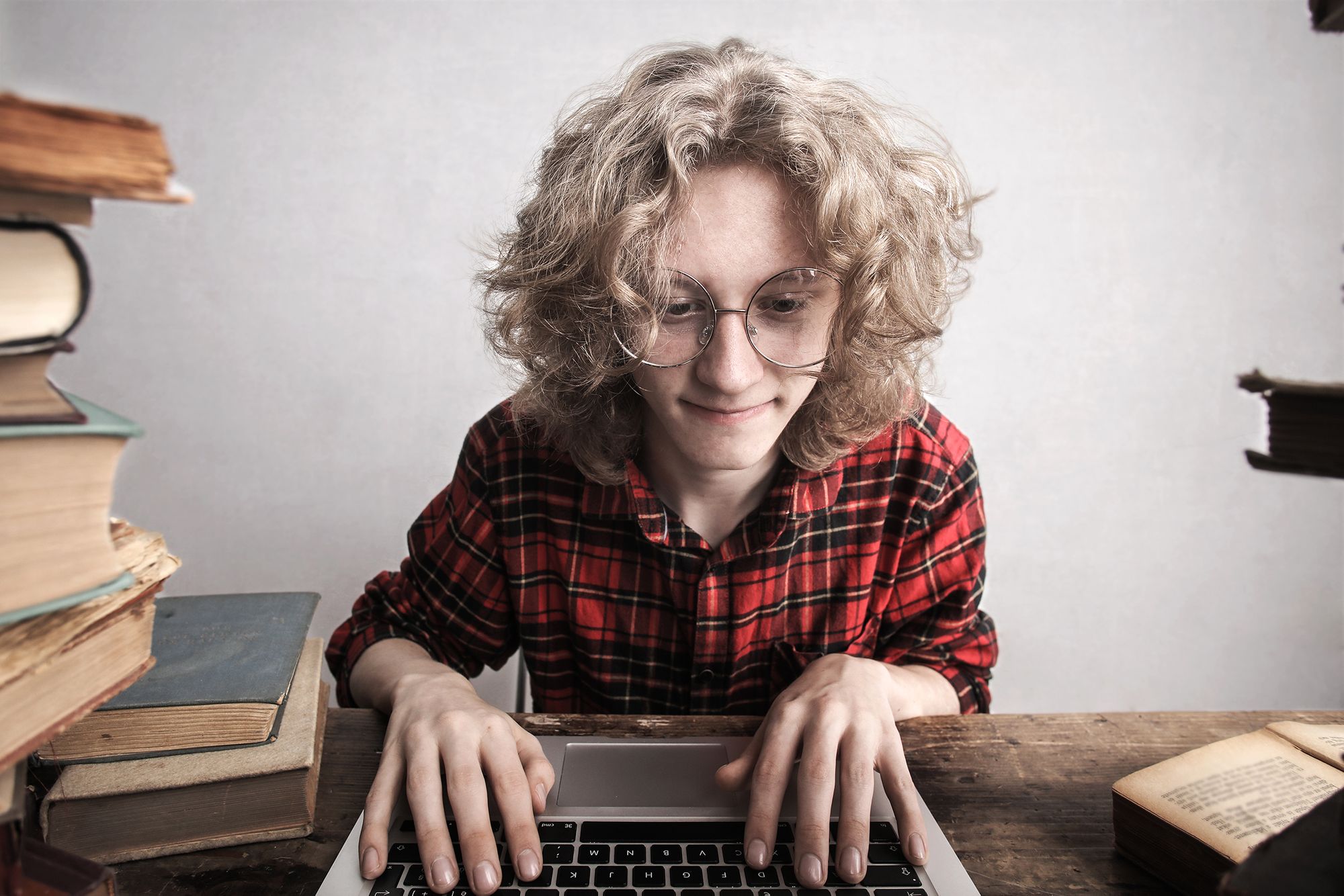 Man writing notes on his laptop