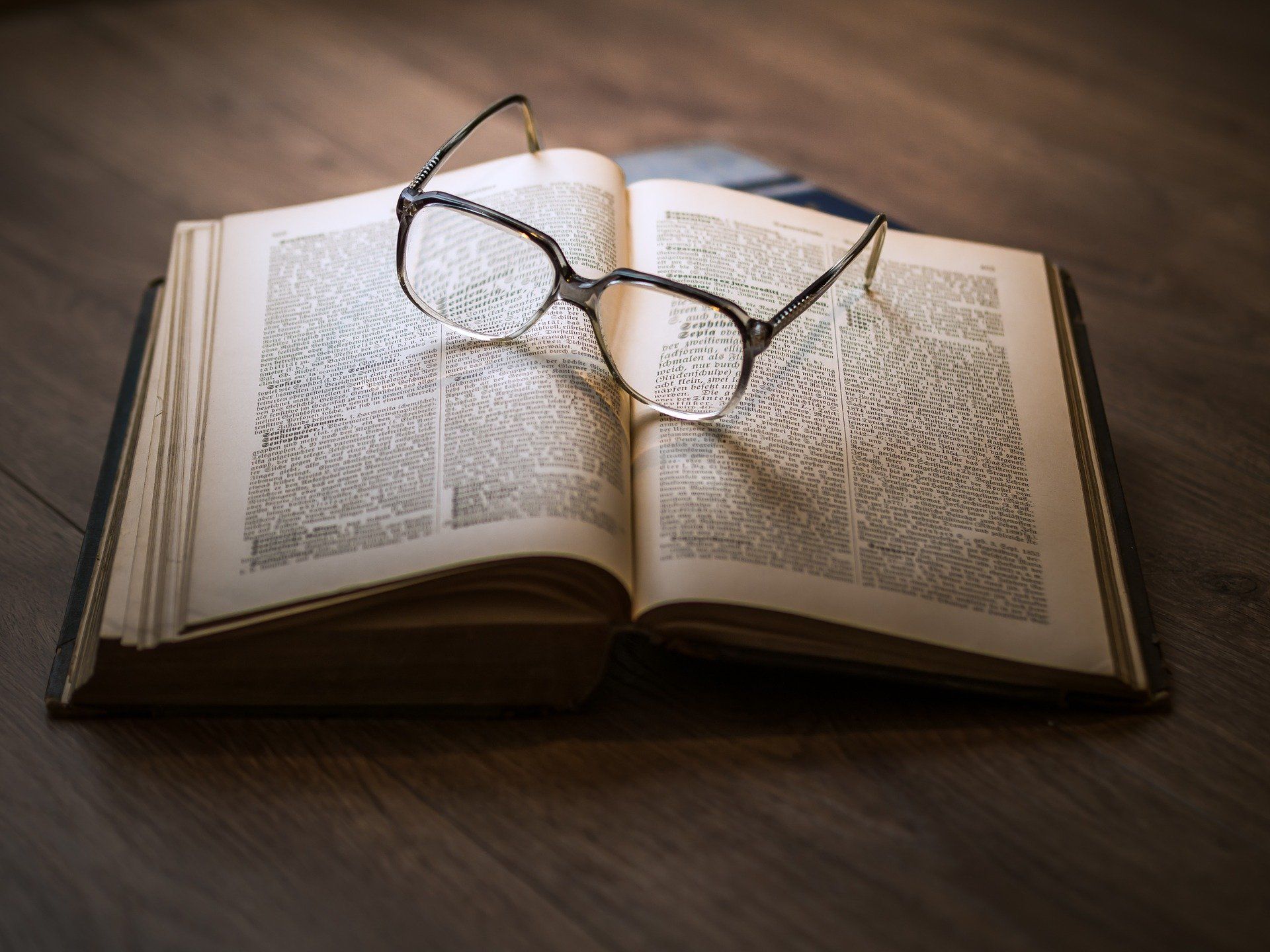 Open book with glasses