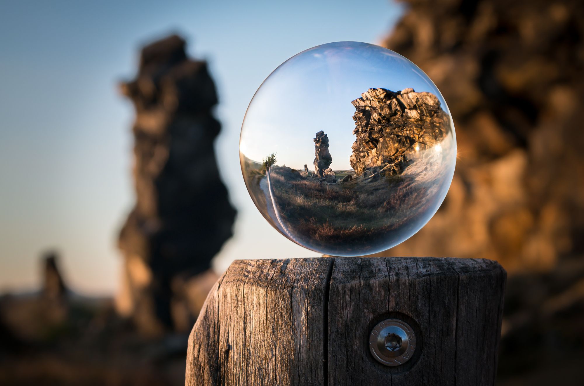 Snow globe on top of a trunk 