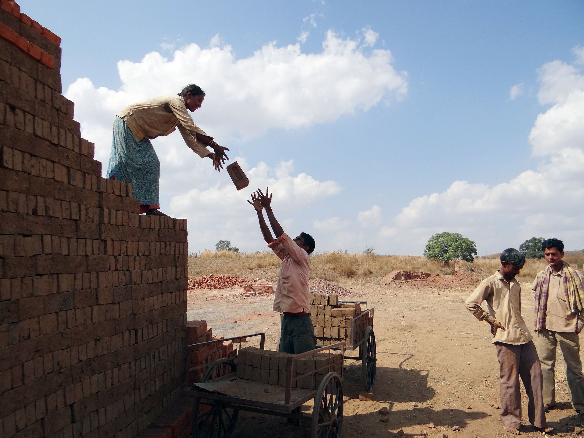 Workers building a wall