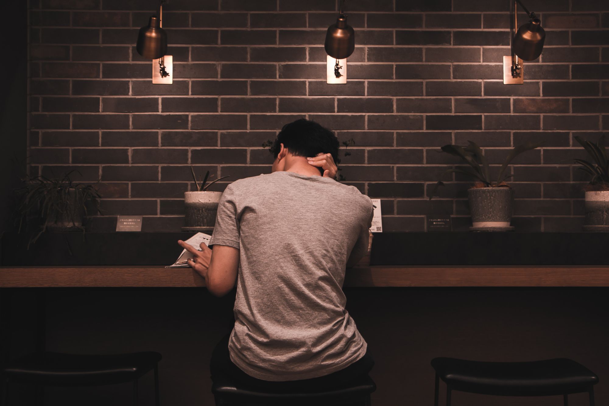 Man reading at a desk the best way to learn a language