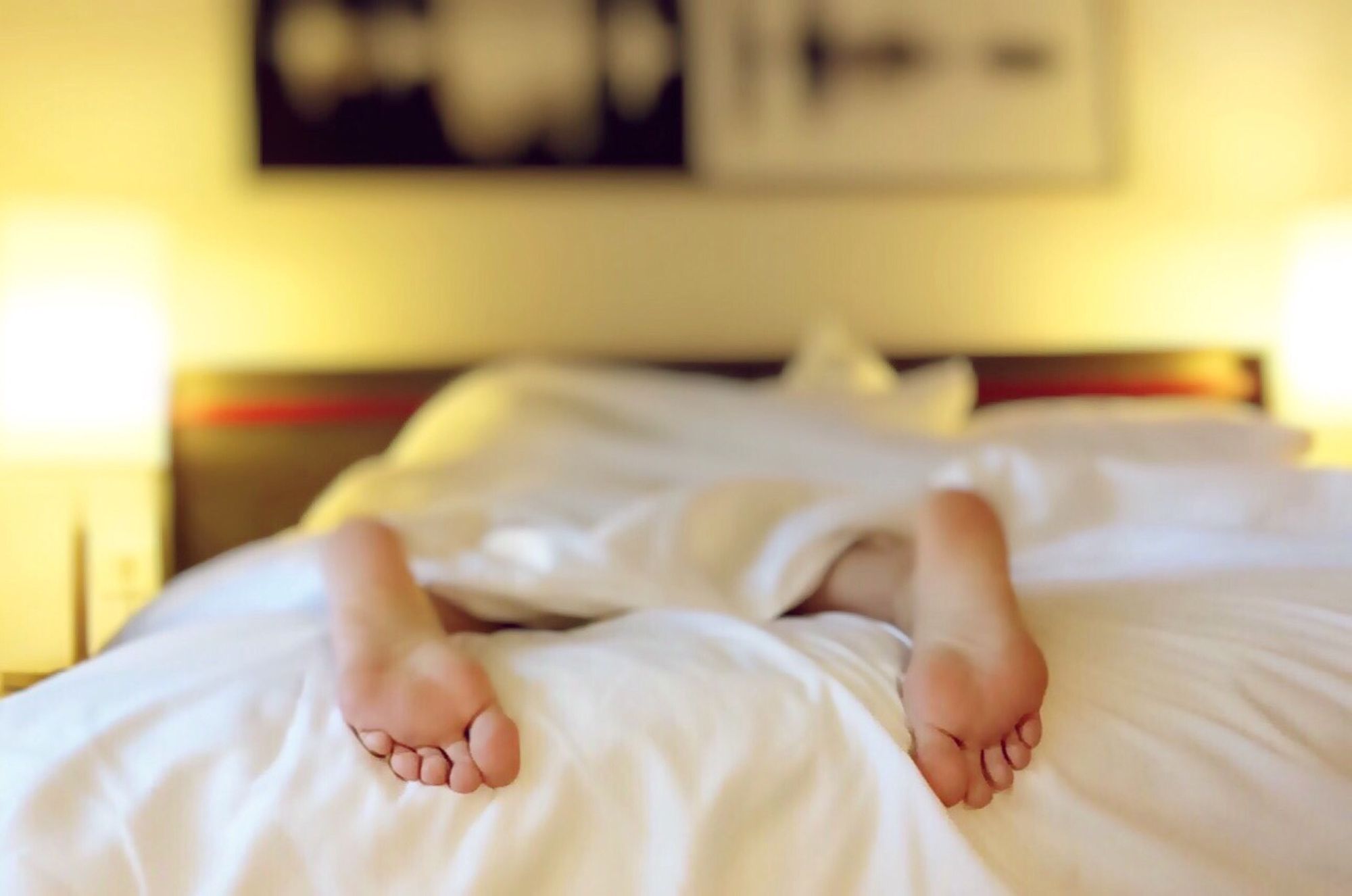 Person lying on the bed resting for brain health