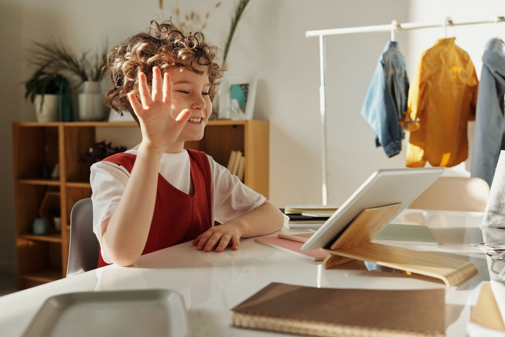 Child studying in front of laptop