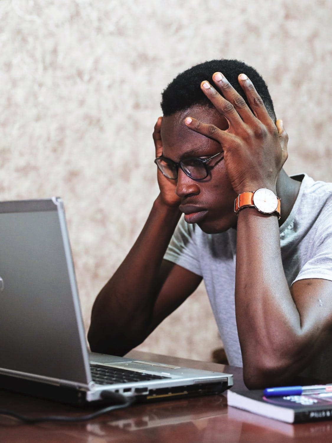 Man at laptop learning Spanish accents