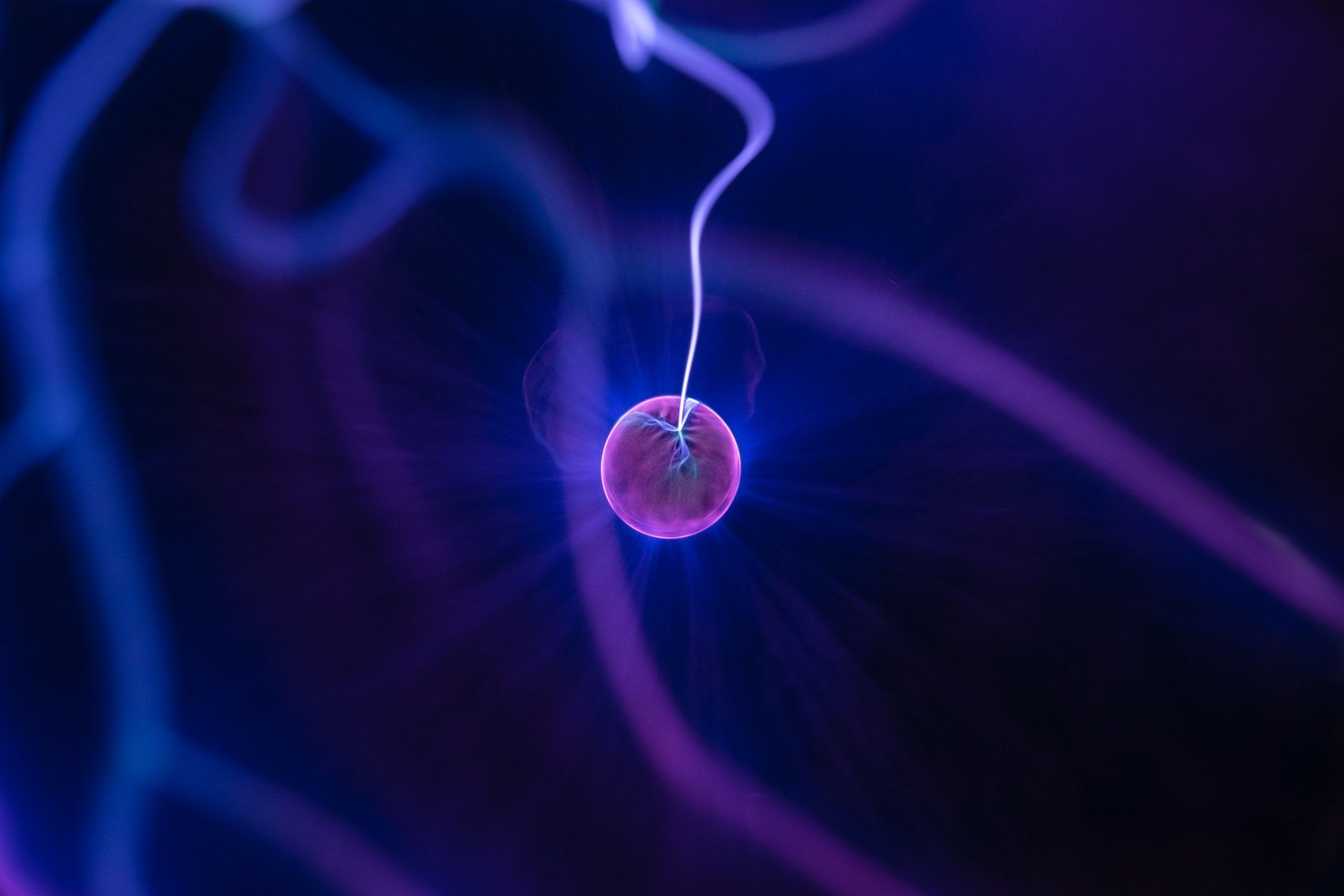 A purple electron demonstrating electromagnetism