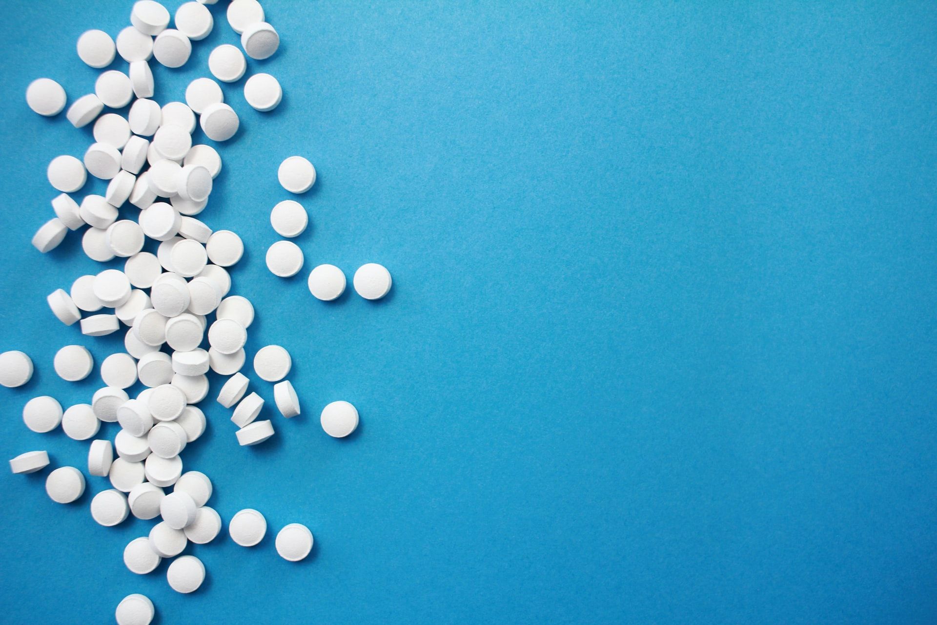Adderall alternatives pills on blue table
