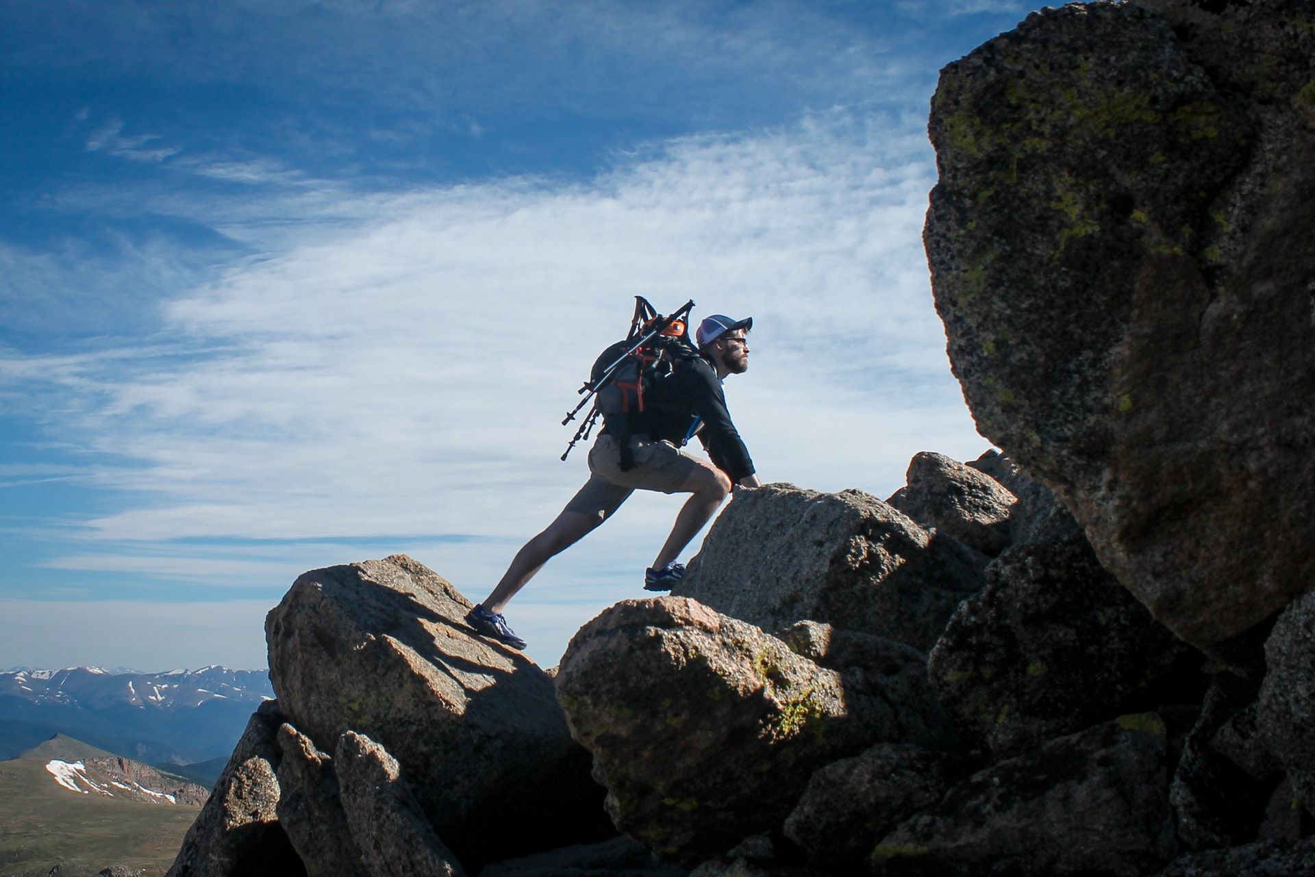 Man climbing rocks learning and development