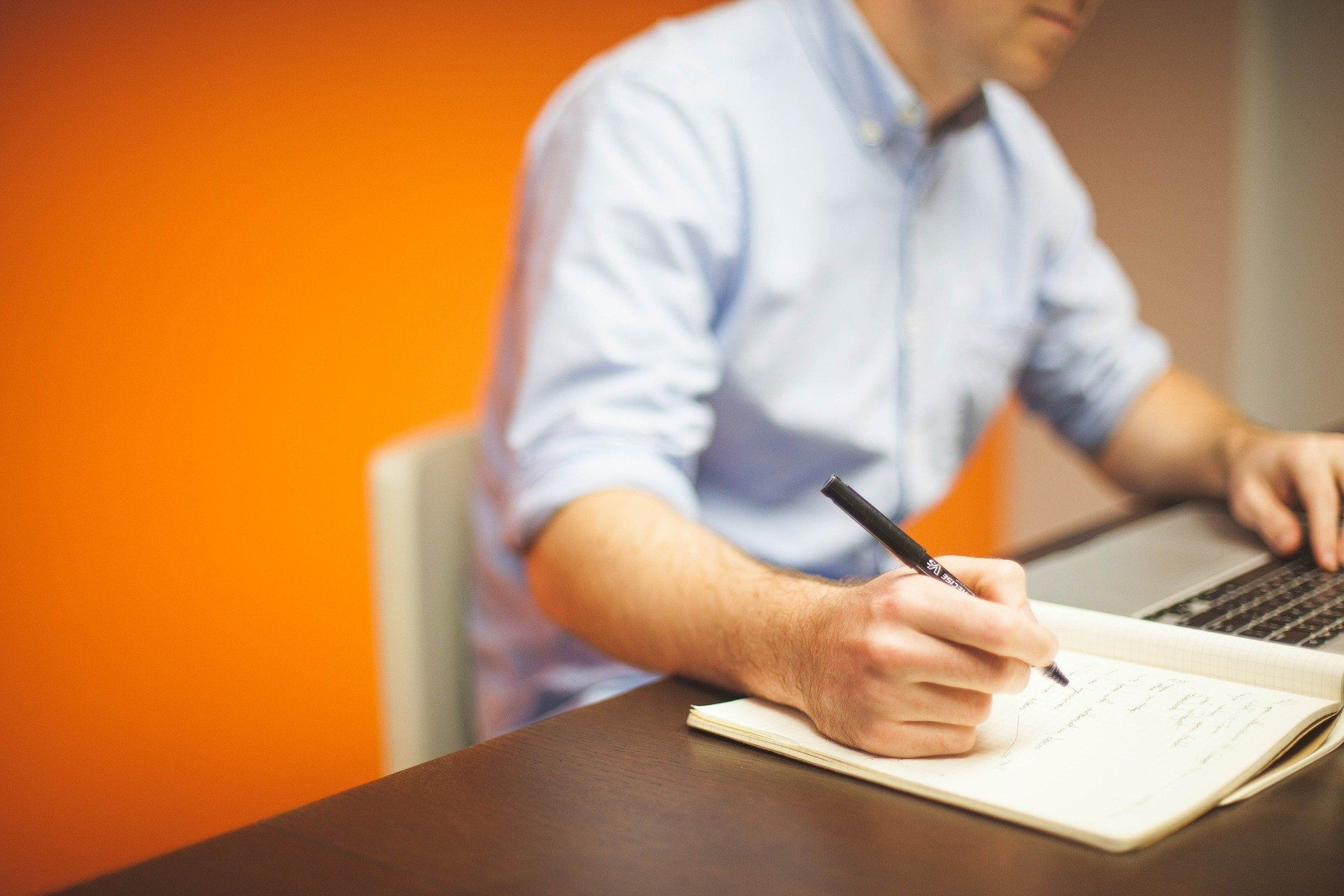 Man working at a desk; How to stay awake to study