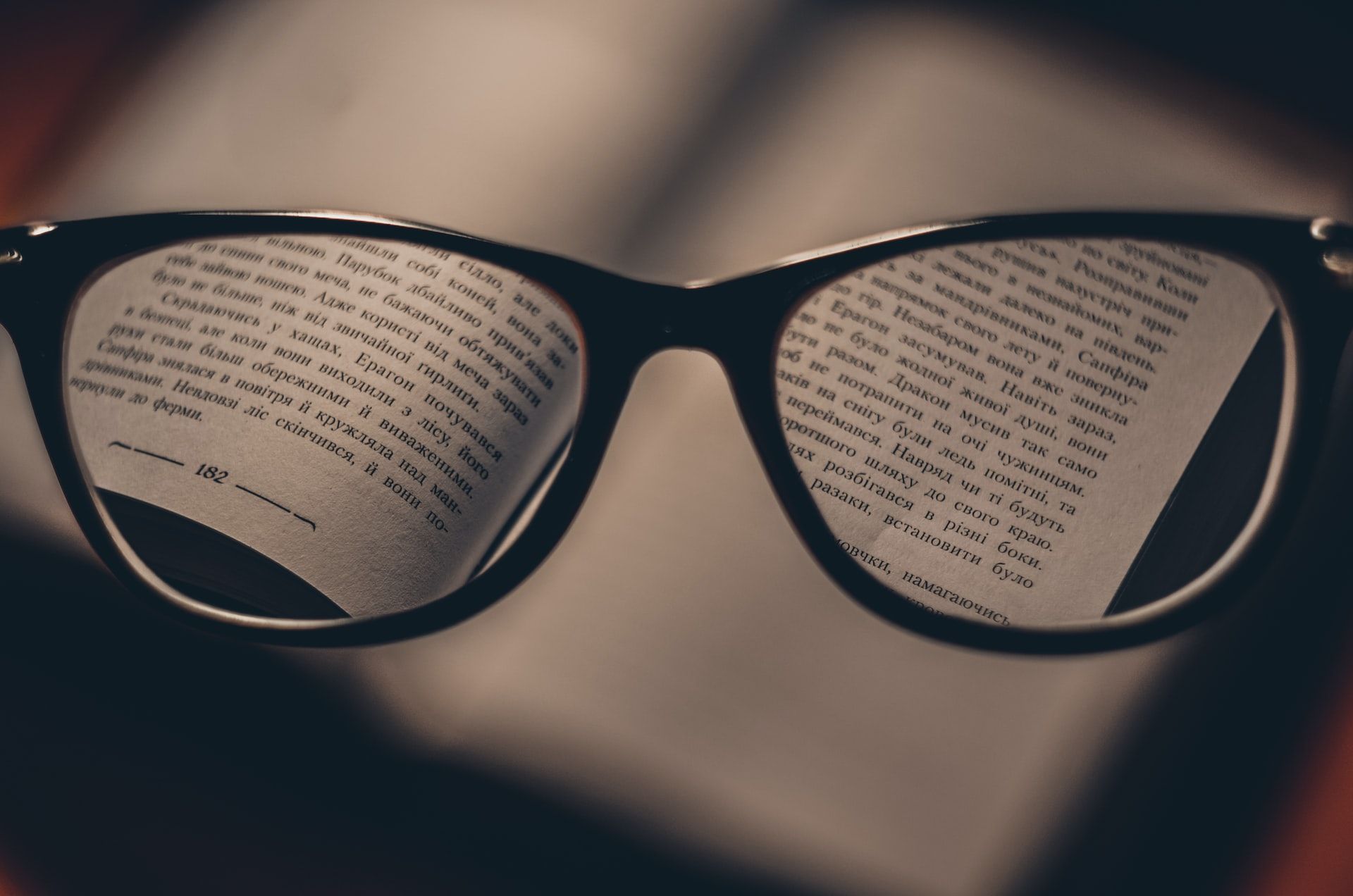 glasses and dictionary to study vocabulary