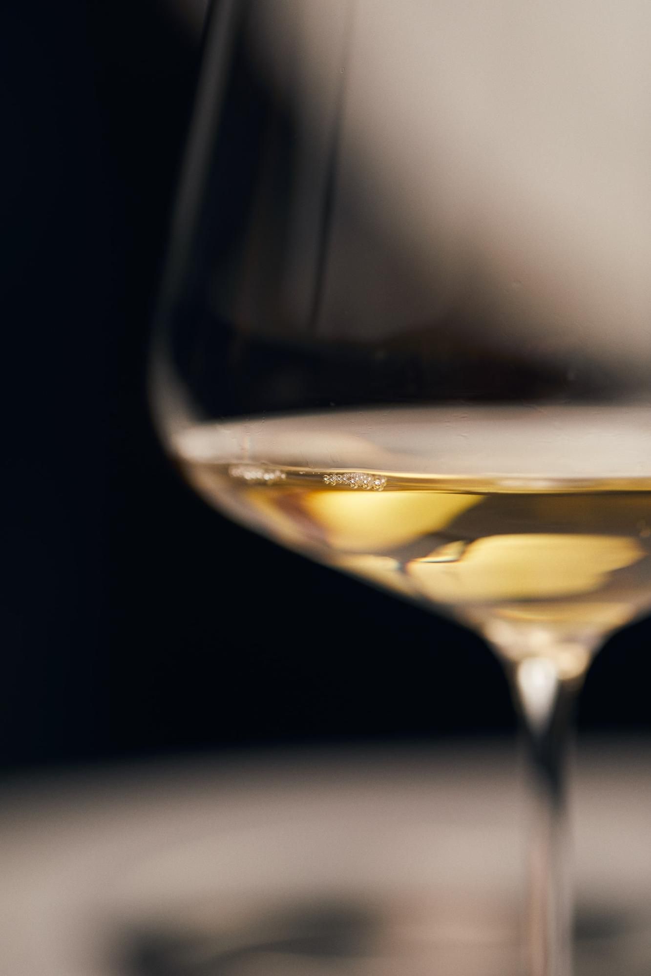 Glass of white wine; wine sommelier