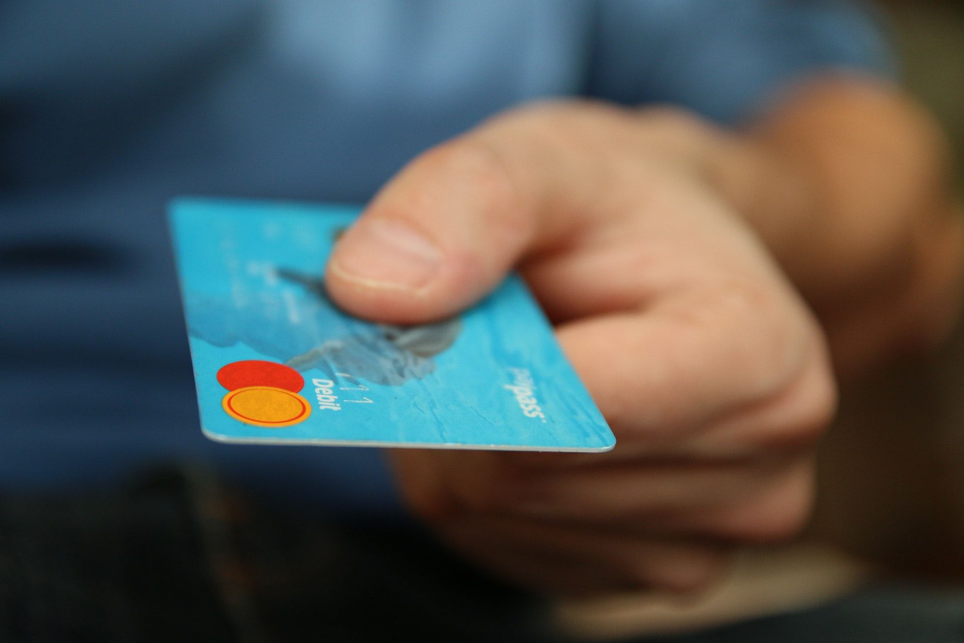 Hand with credit card for a wine sommelier