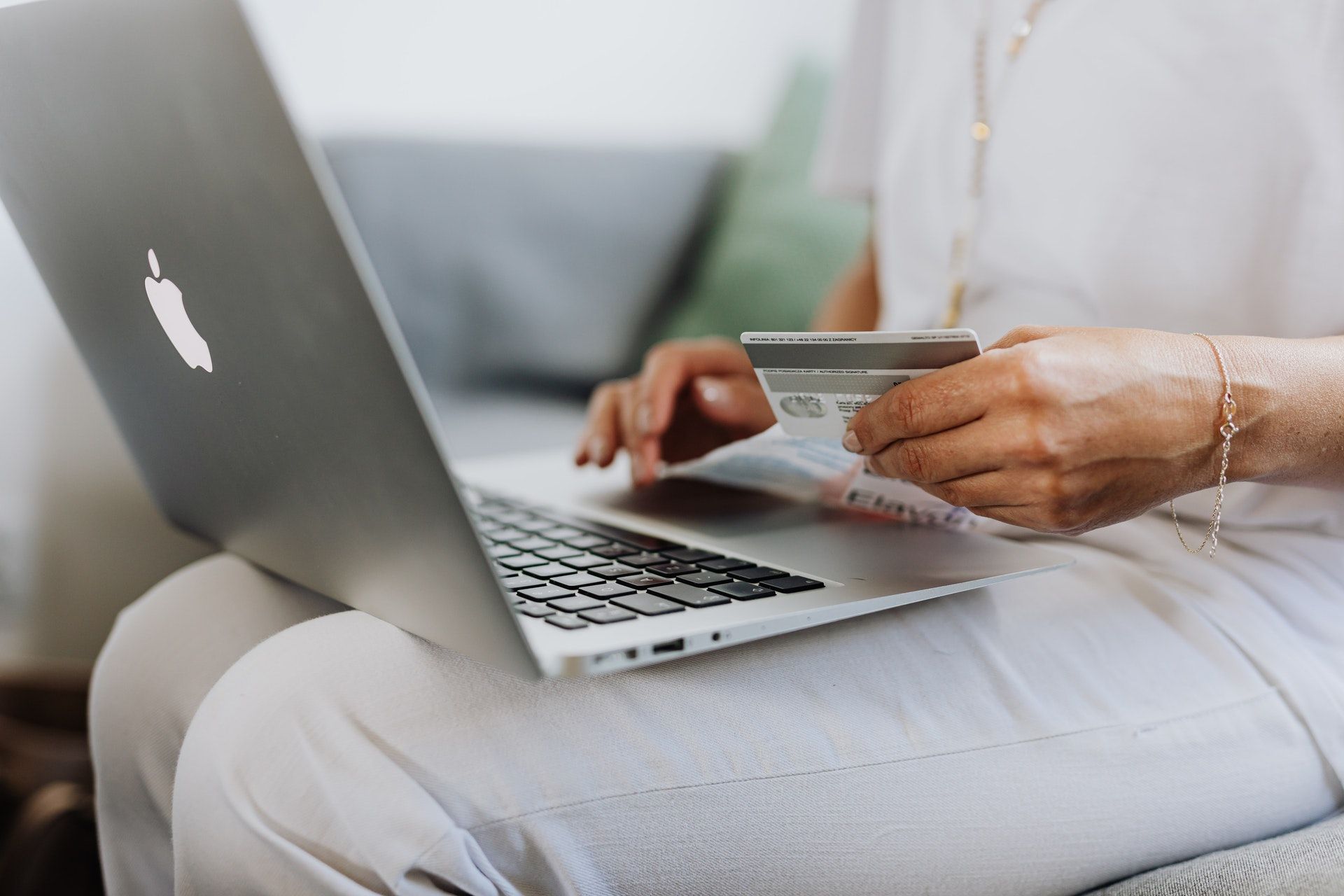 Laptop on lap; buy wine online