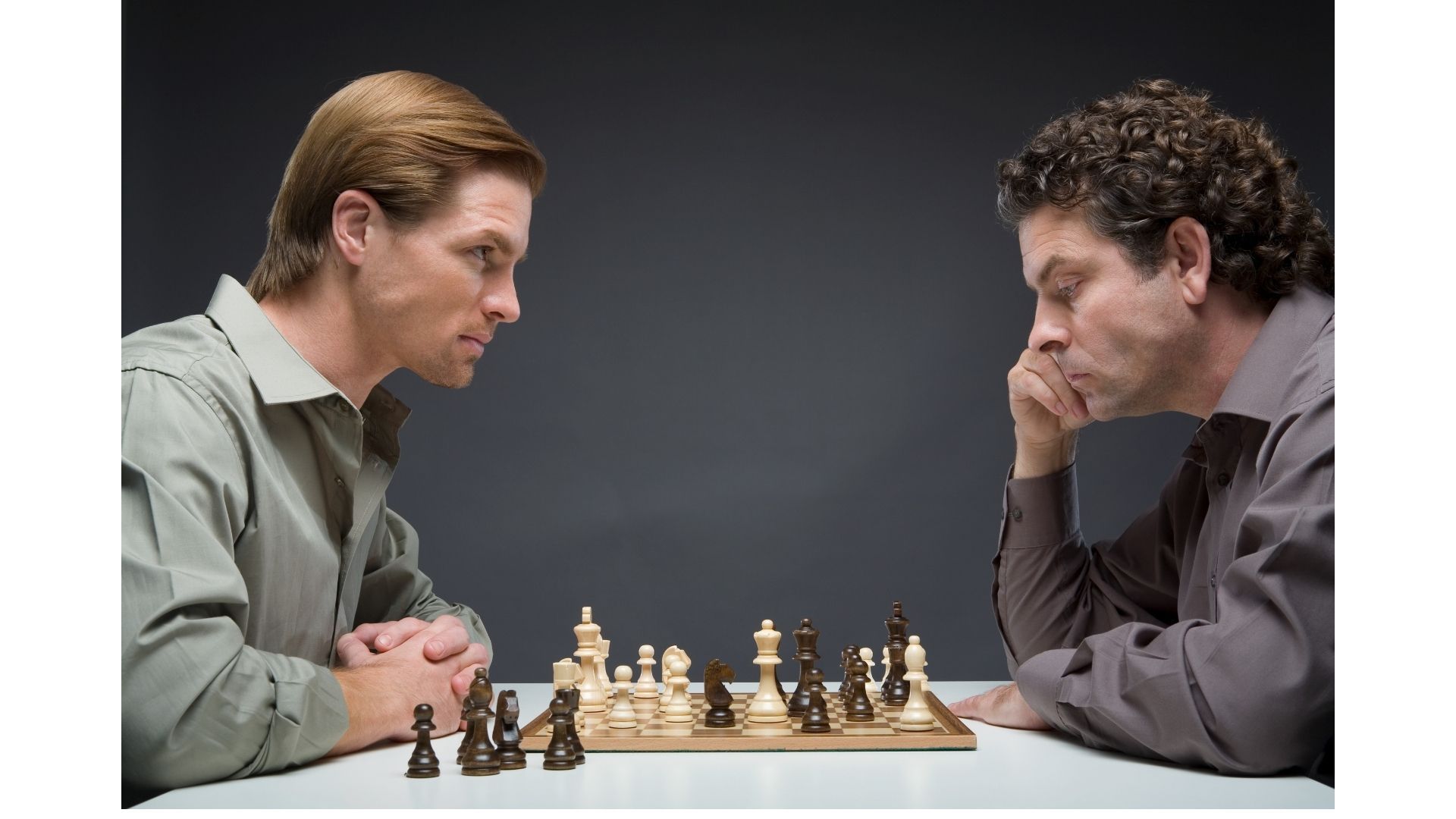 Concentrated serious boy developing chess gambit, strategy ,playing board  game to winner clever concentration and thinking child while playing chess.  Learning, tactics and analysis concept. Free Photo