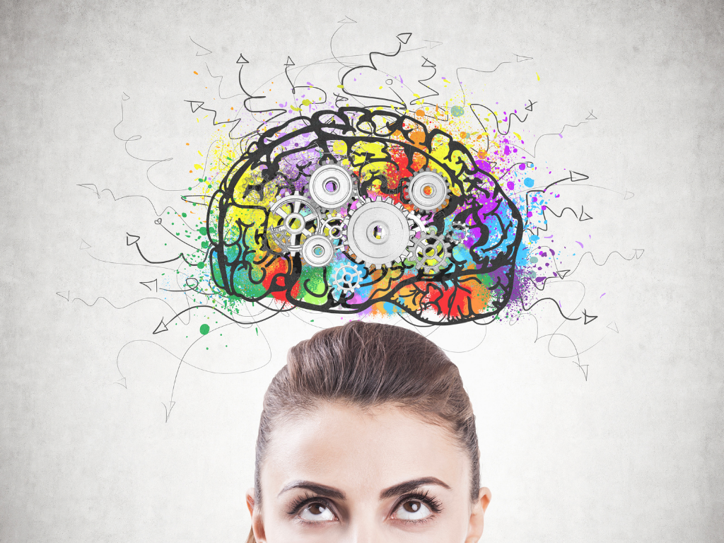 Colourful brain above girl; MCAT critical thinking.png