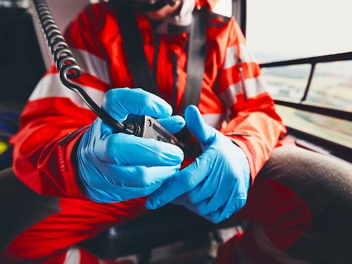 EMS professional using radio to tell hospital about an incoming patient