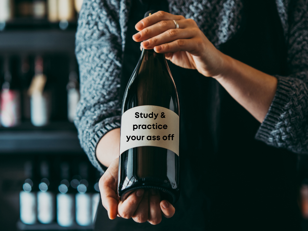 Wine bottle with the words study & practice your ass off on the label